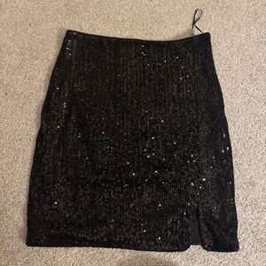 Black, sequin, Princesses Polly miniskirt. Very stretchy.